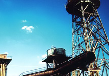 Industrial tower complex abandoned next to water